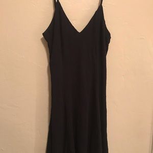 strappy open back little black dress .